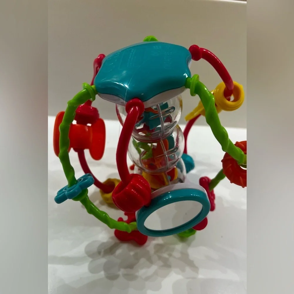 PLAY GO - LITTLE HANDS ACTIVITY BALL.  KEEPS YOUR CHILD’S HANDS BUSY. LIKE NEW